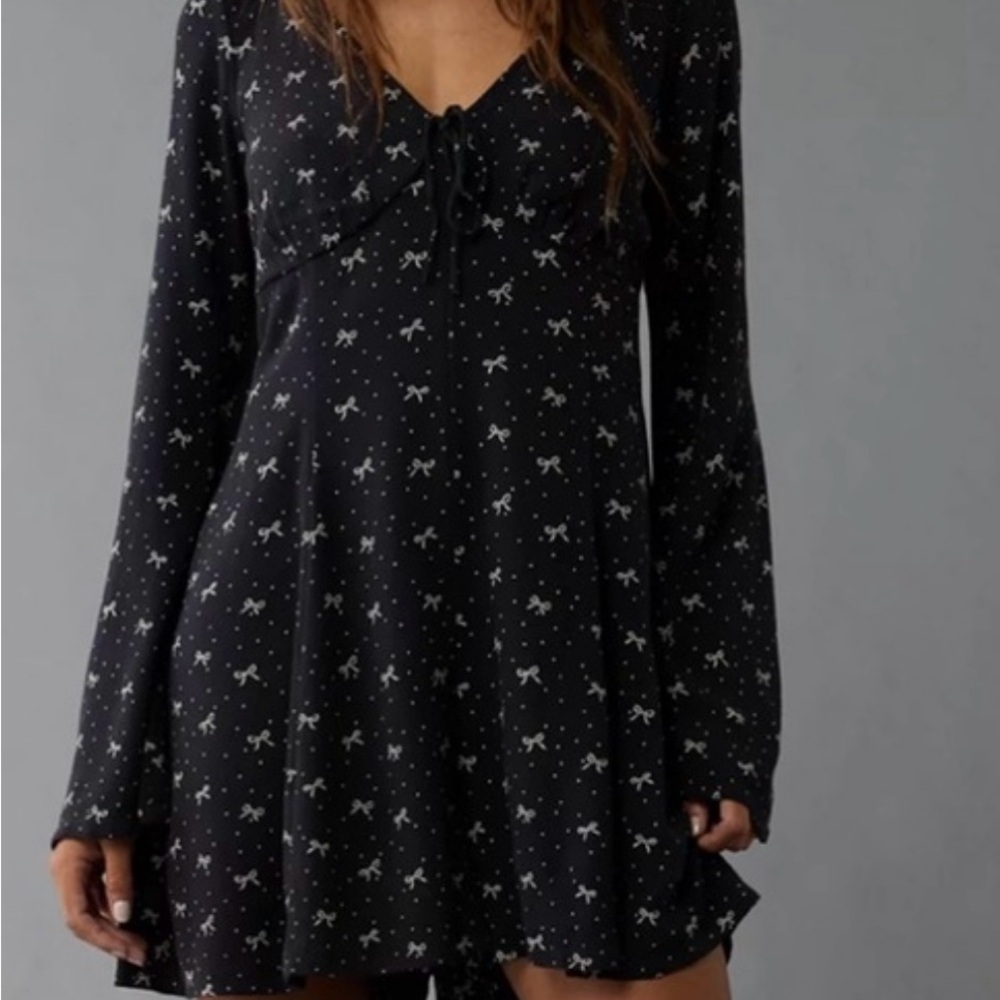 Black polka dot bow romper